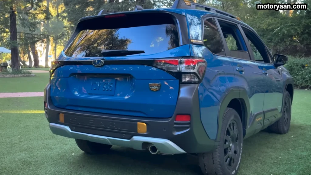 2027 Subaru Forester Wilderness Hybrid rear three quarter profile showing rugged design and roof rails
