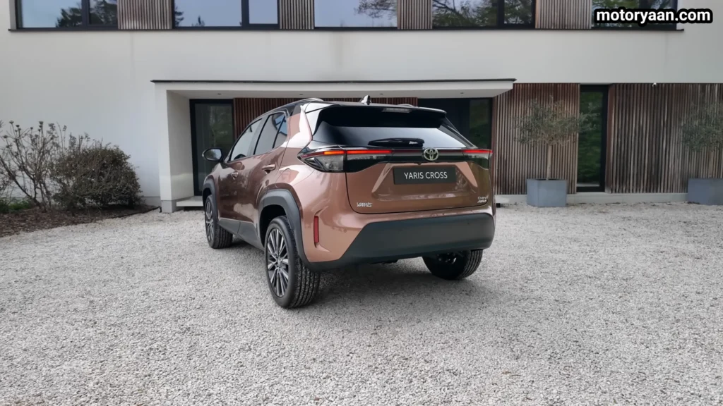 2026 Toyota Yaris Cross rear three quarter view showing taillights and rear design