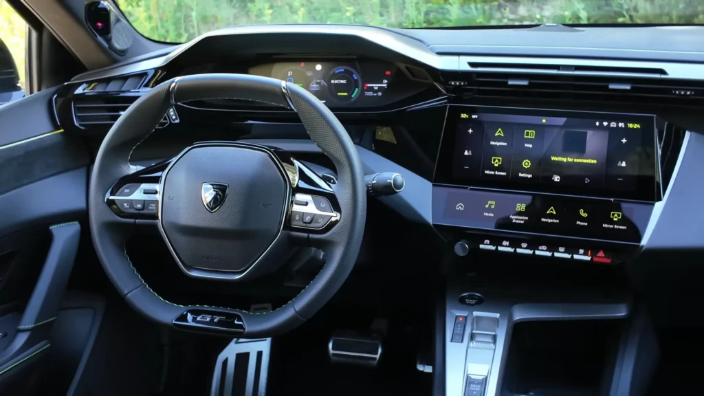 2026 Peugeot 408 Facelift steering wheel close up with controls digital instrument cluster and infotainment display